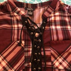 A maroon white and black shirt